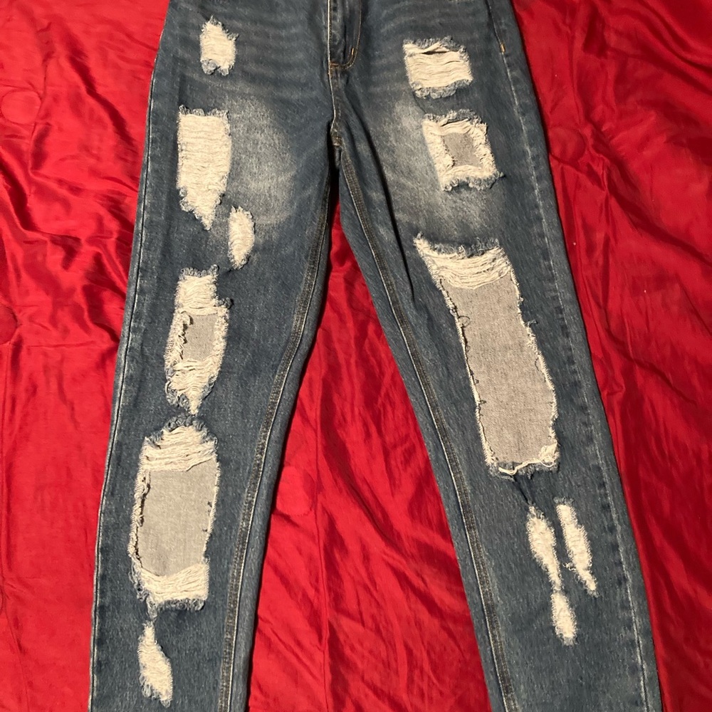 Medium wash distressed Fashion Nova jeans size medium worn once.